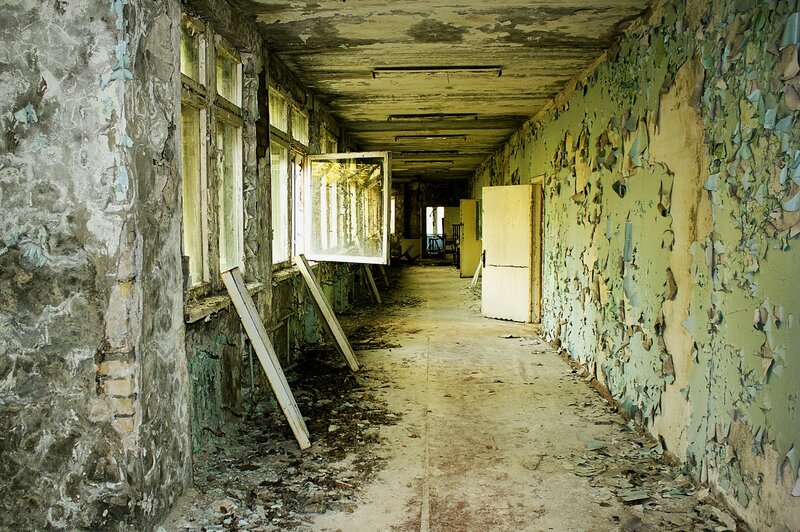 Abandoned corridor with peeling paint