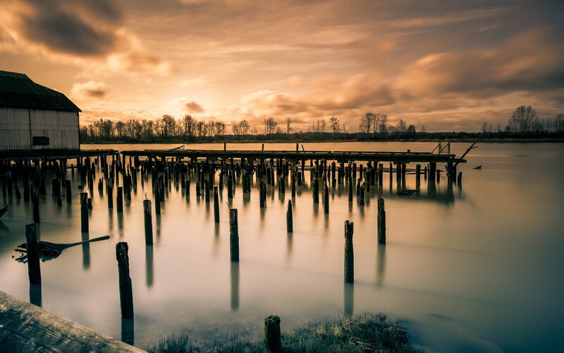 Abandoned Dock at Sunset — Orange, Serene