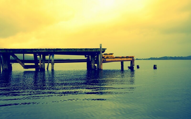 abandoned dock at sunset