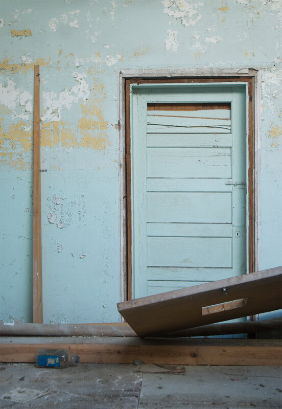 abandoned door in dilapidated room