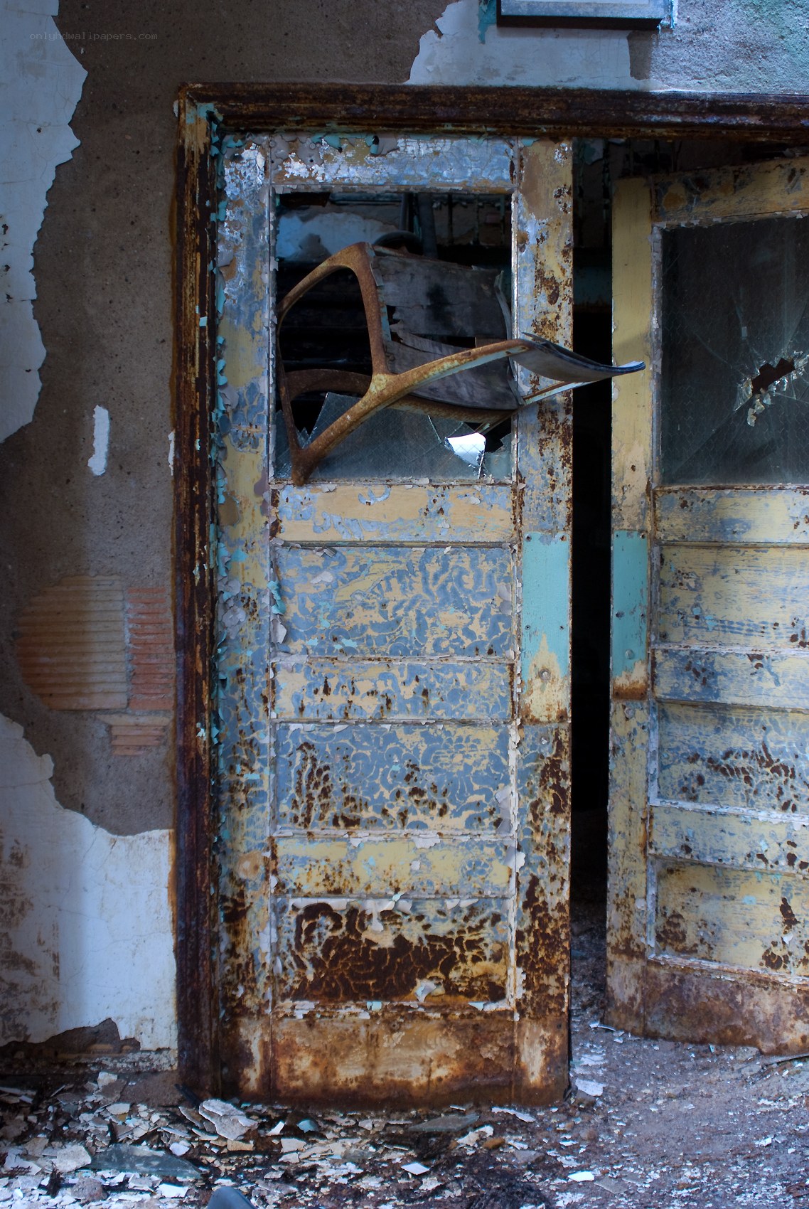 abandoned door with broken glass