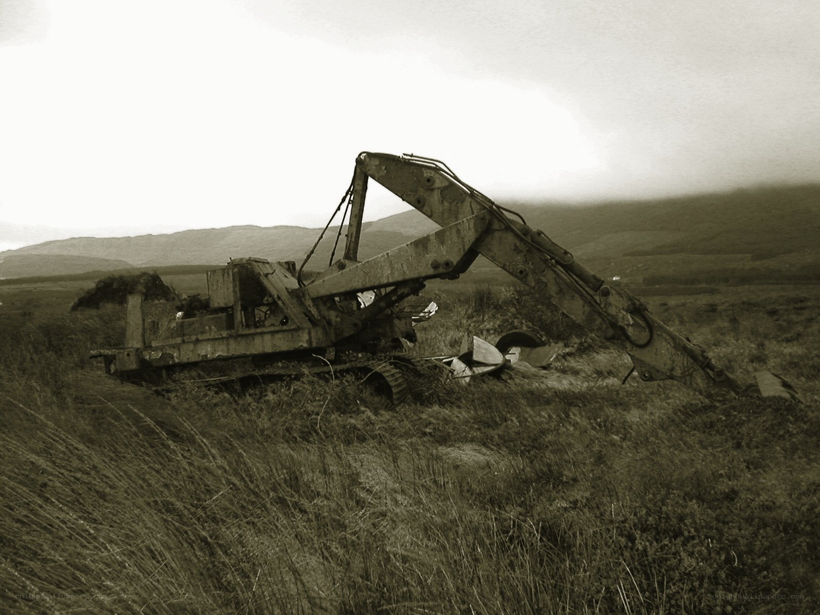 Abandoned excavator in field