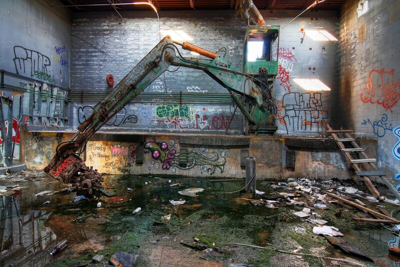 Abandoned Excavator in Warehouse