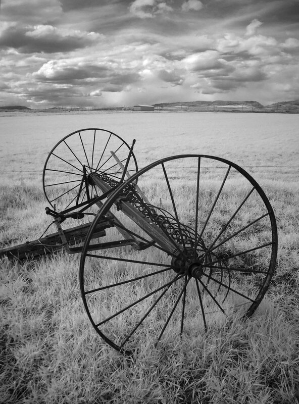 Abandoned farm equipment in field