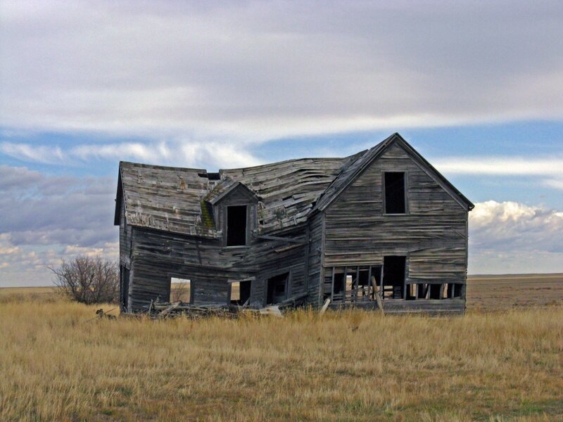 abandoned farmhouse in prairie