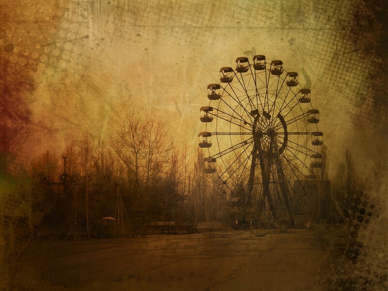 abandoned ferris wheel at sunset
