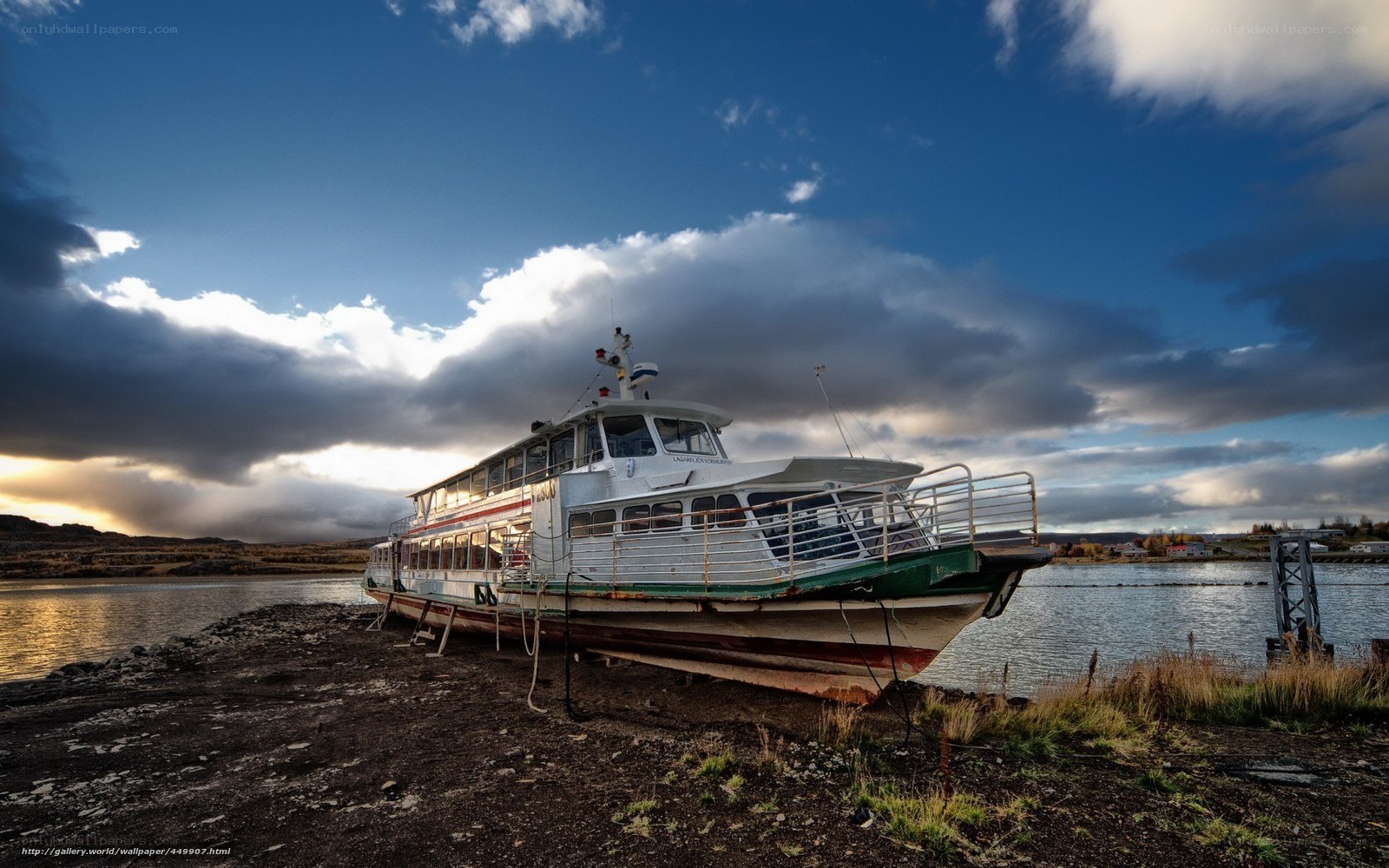 Abandoned ferry on shore