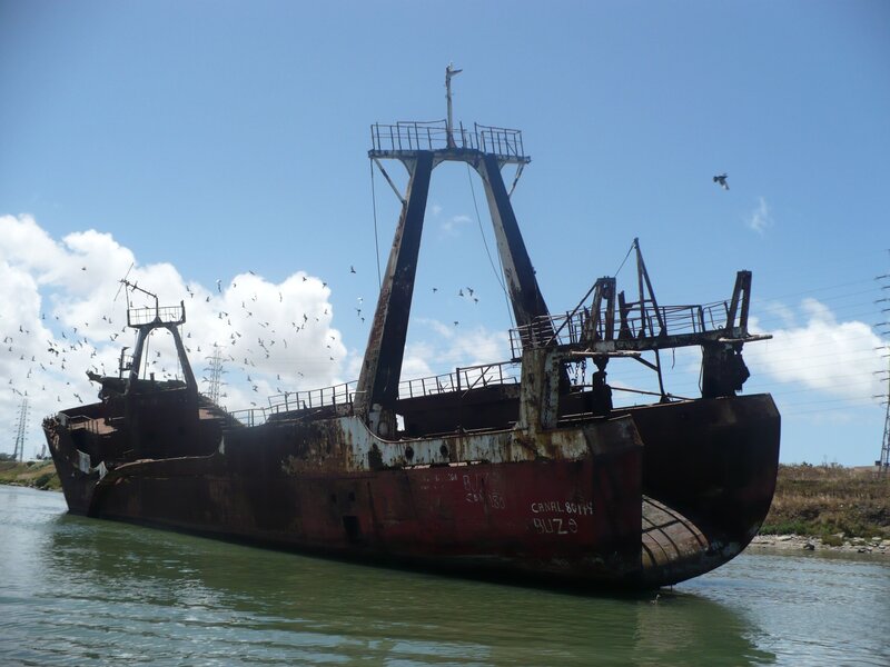 Abandoned fishing boat in canal
