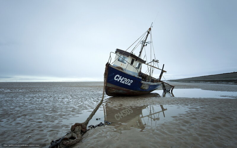 Abandoned fishing boat on beach
