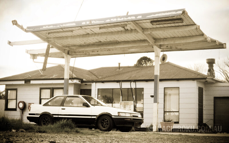 Abandoned gas station with car