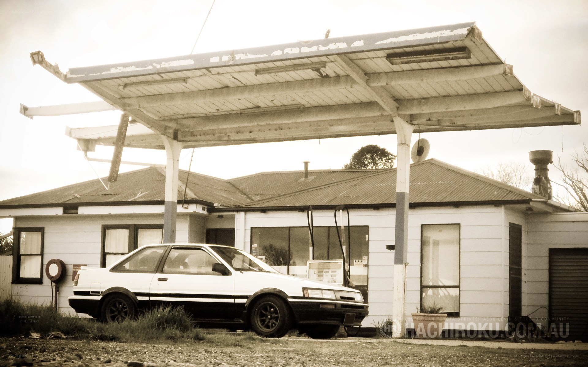 Abandoned gas station with car