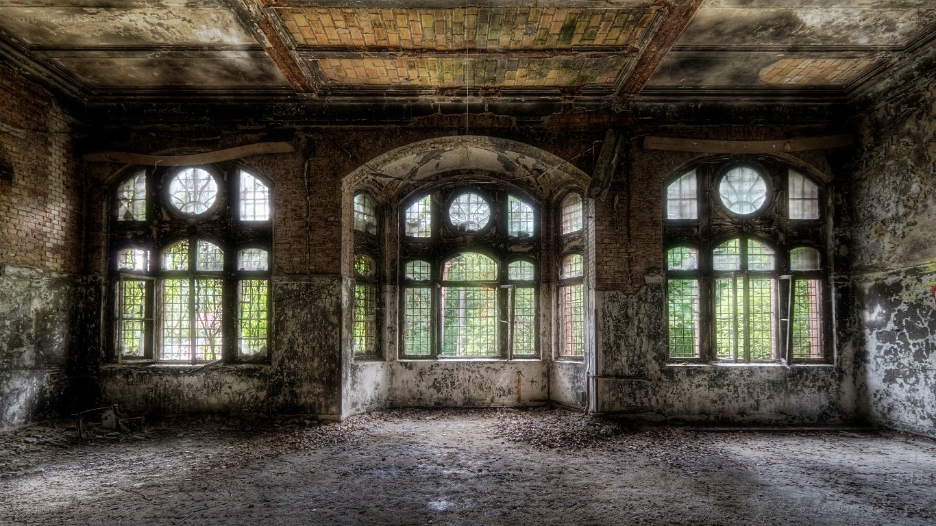 Abandoned hall with arched windows