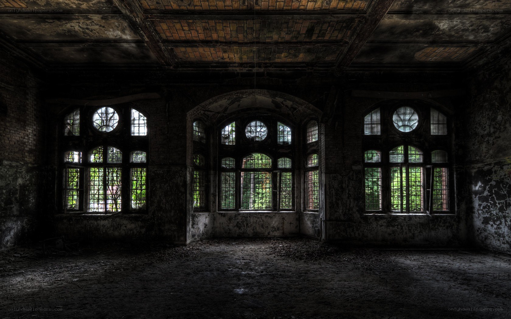 Abandoned hall with arched windows