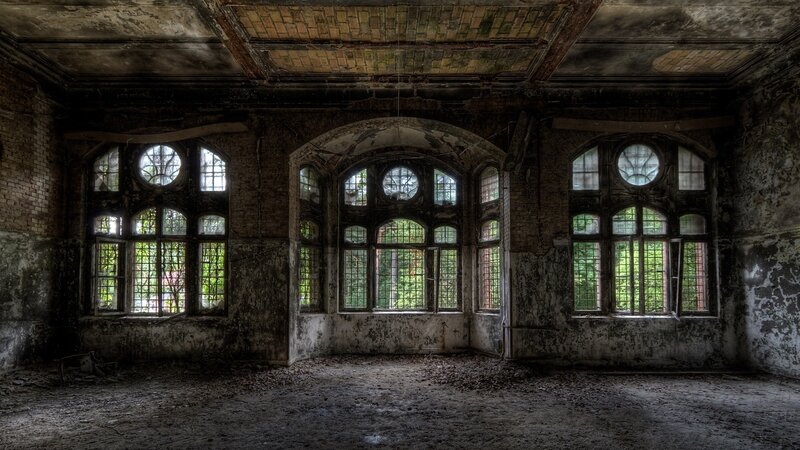 abandoned hall with arched windows