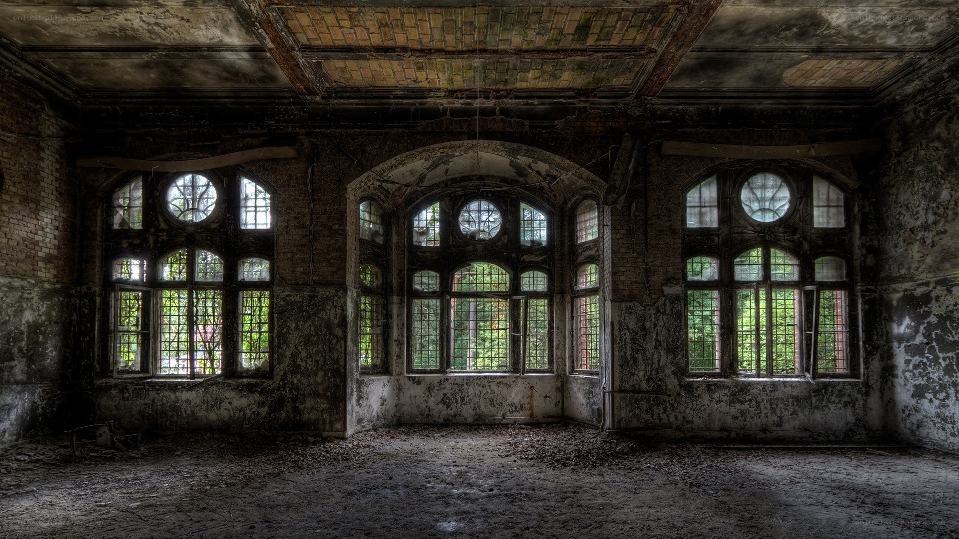 abandoned hall with arched windows