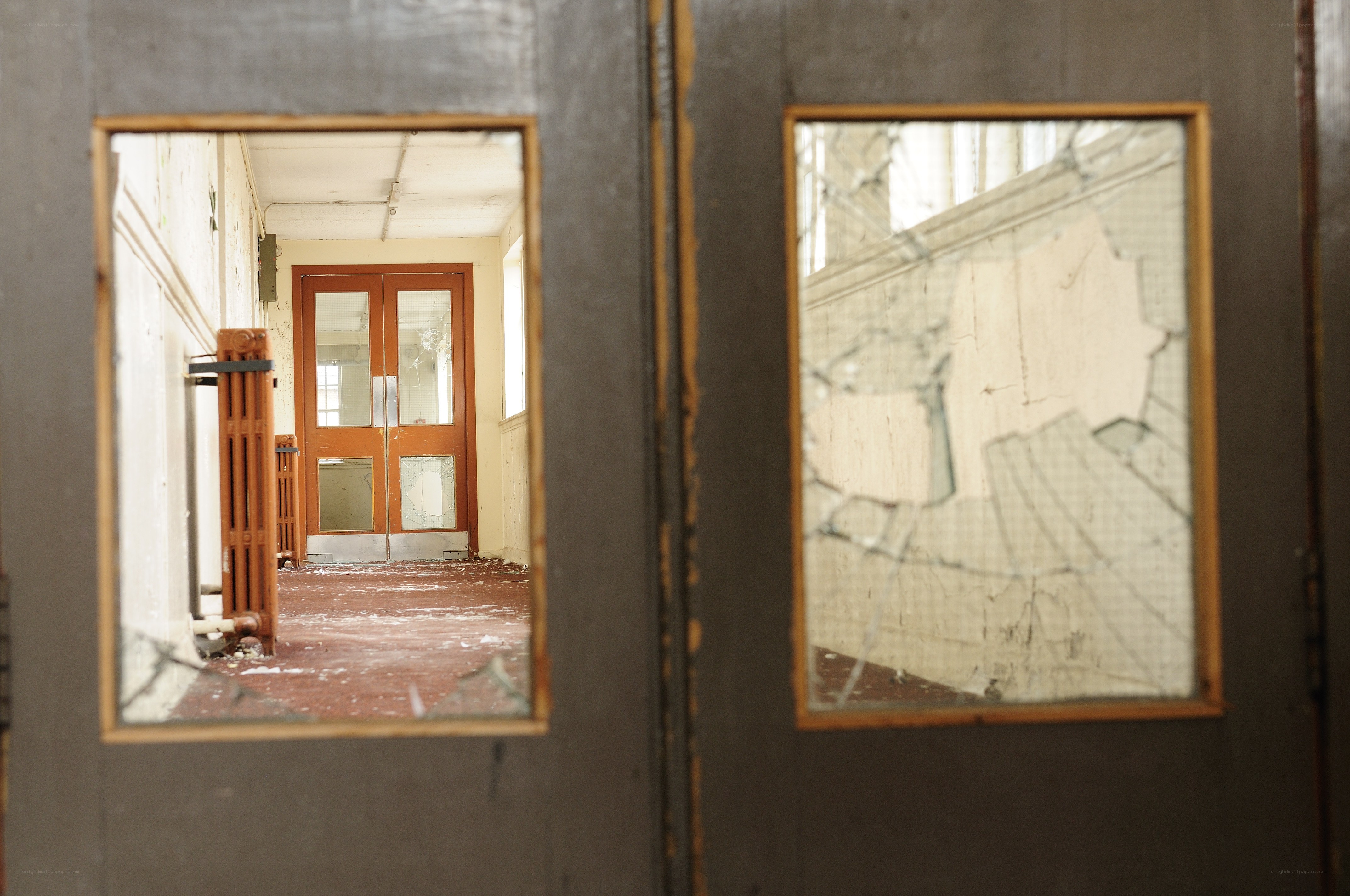 abandoned hallway through broken glass