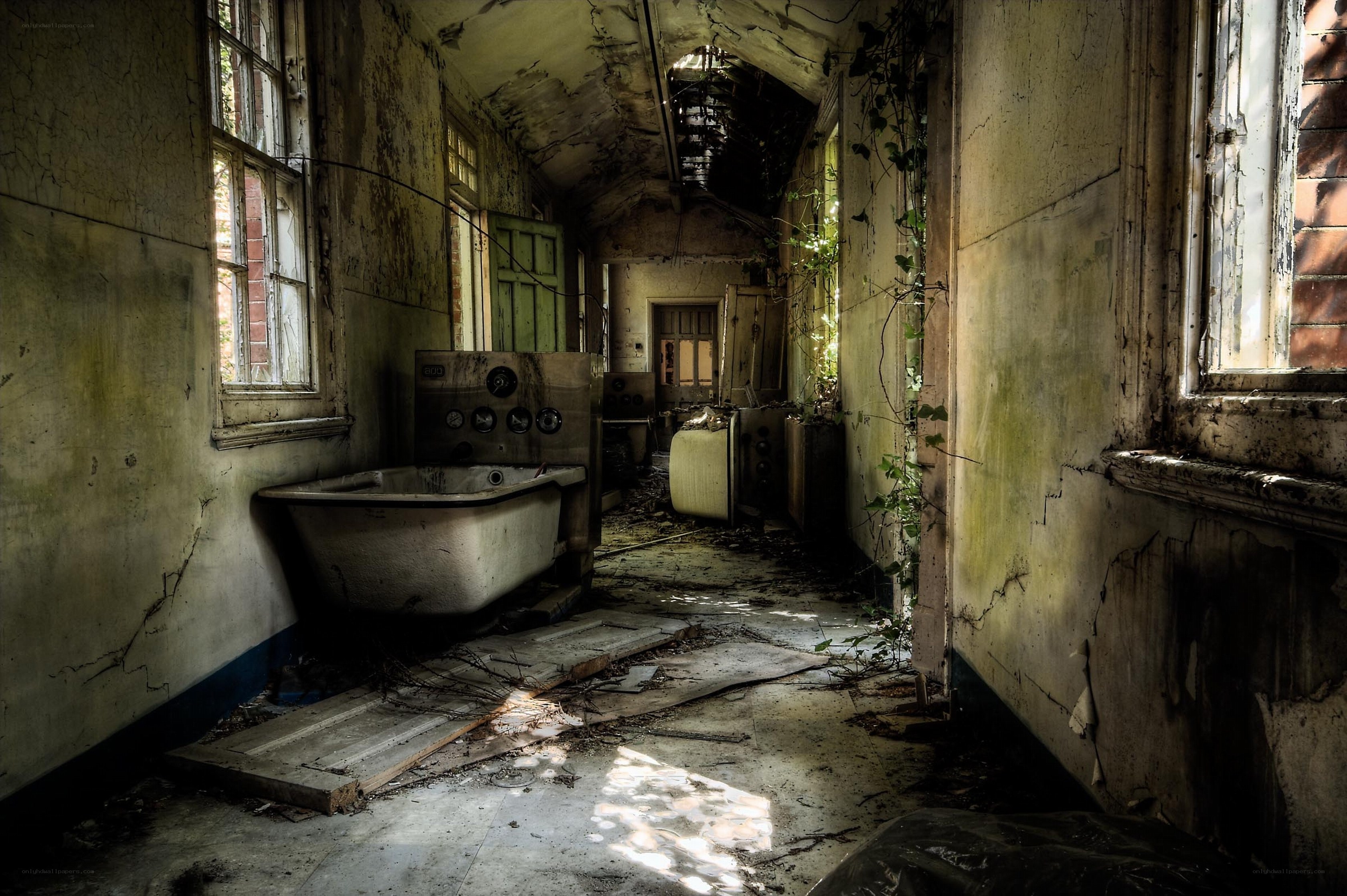 abandoned hallway with bathtub