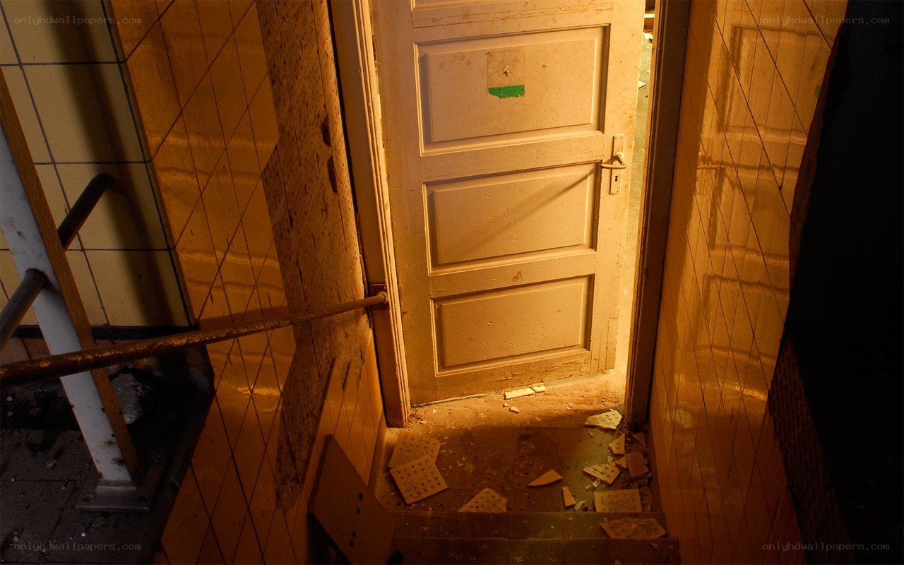 abandoned hallway with broken door