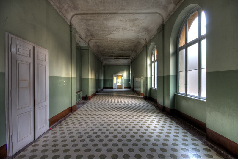 abandoned hallway with hexagonal tiles