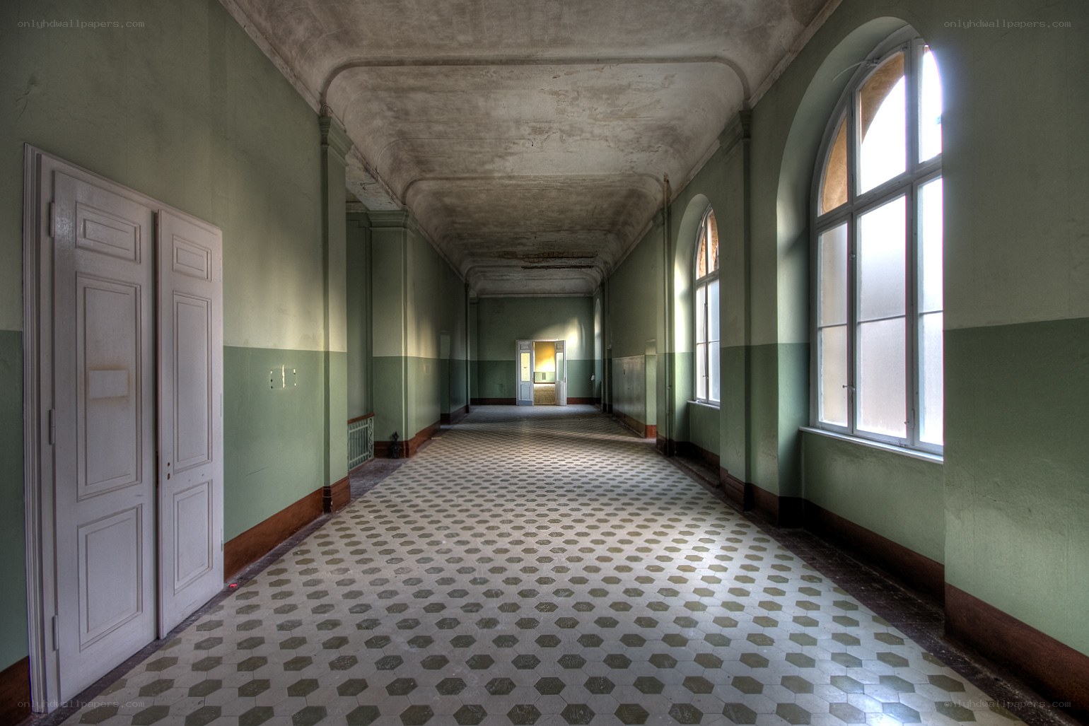 abandoned hallway with hexagonal tiles