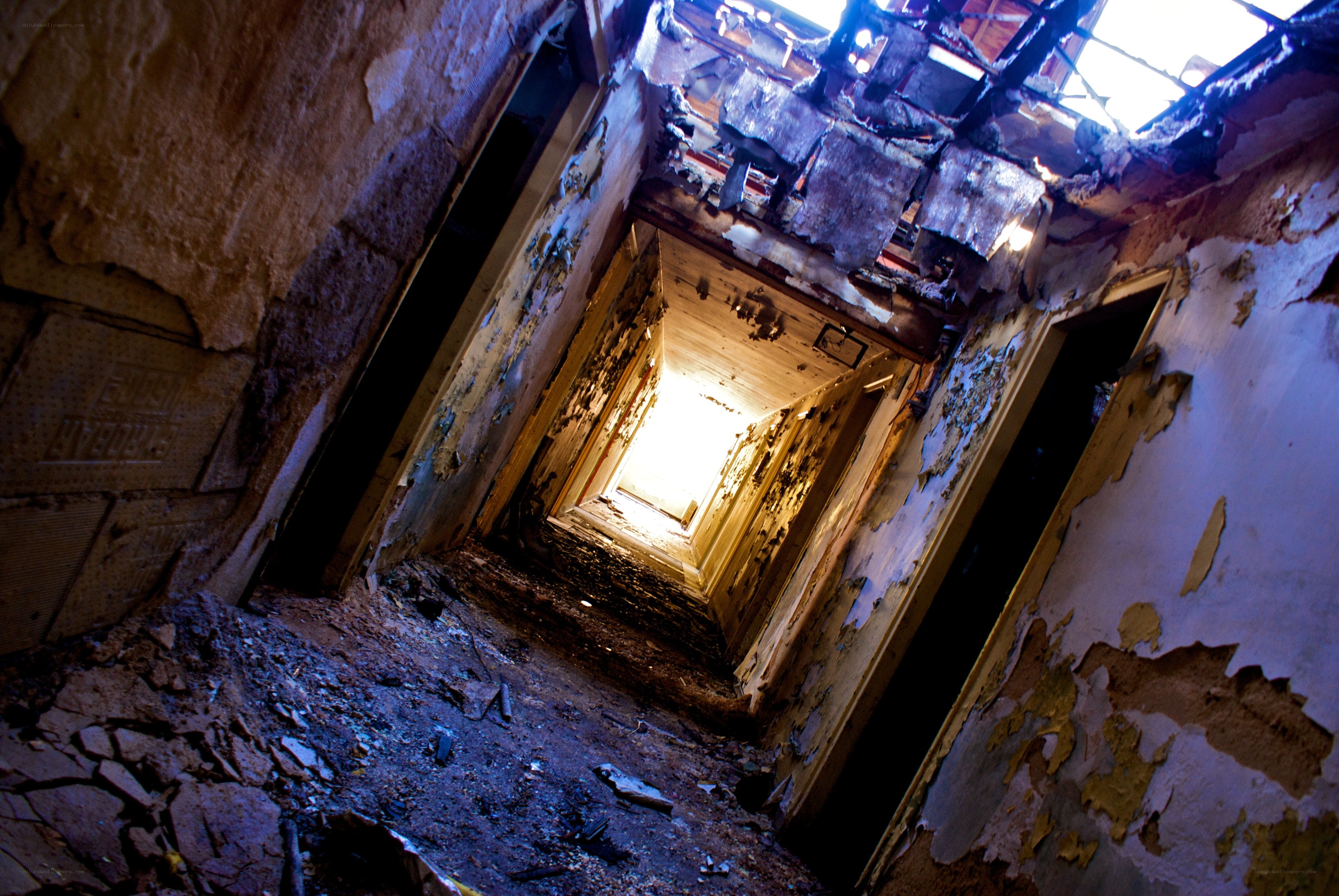 abandoned hallway with light at end