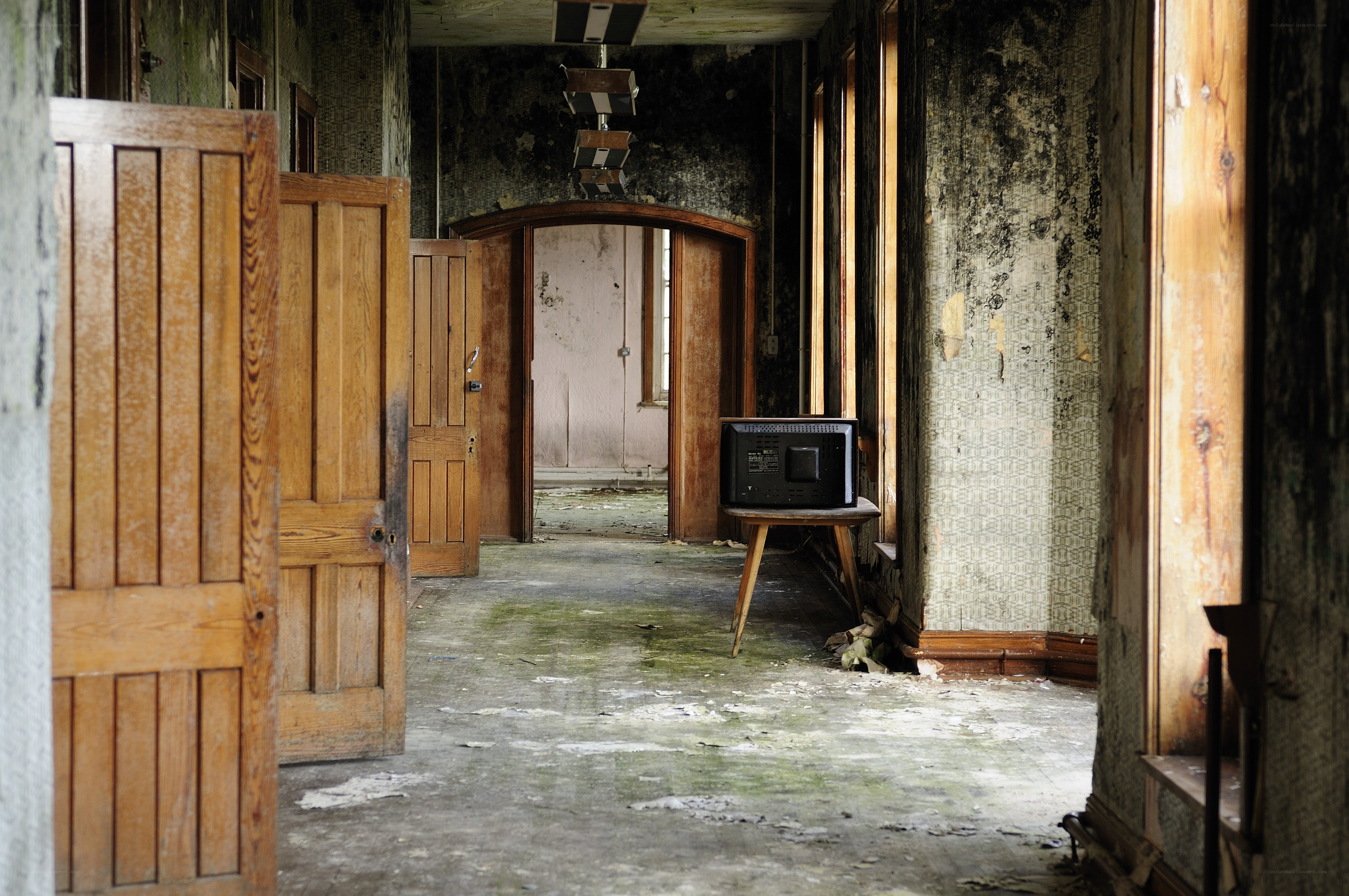 abandoned hallway with old TV