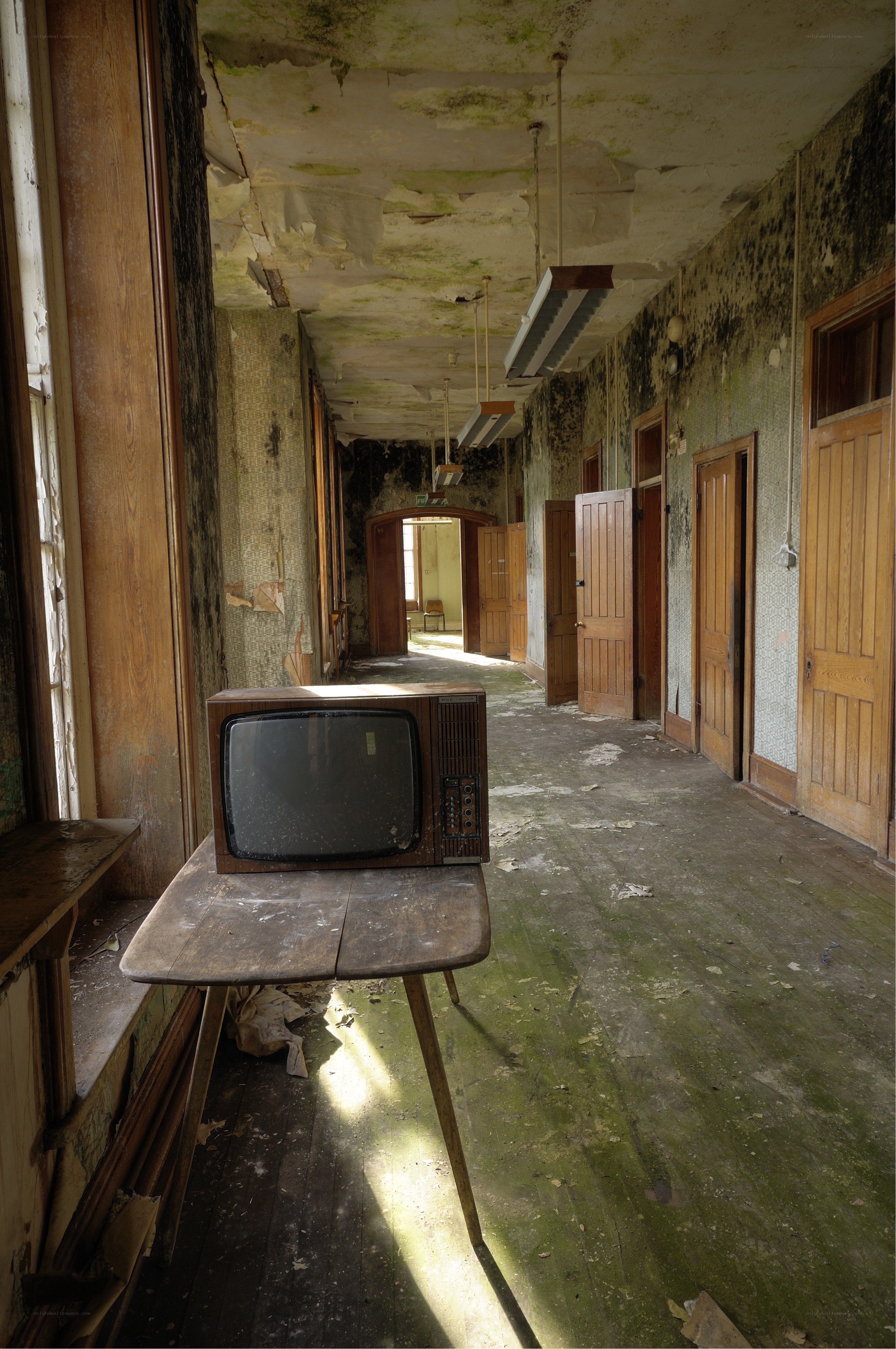 abandoned hallway with old TV