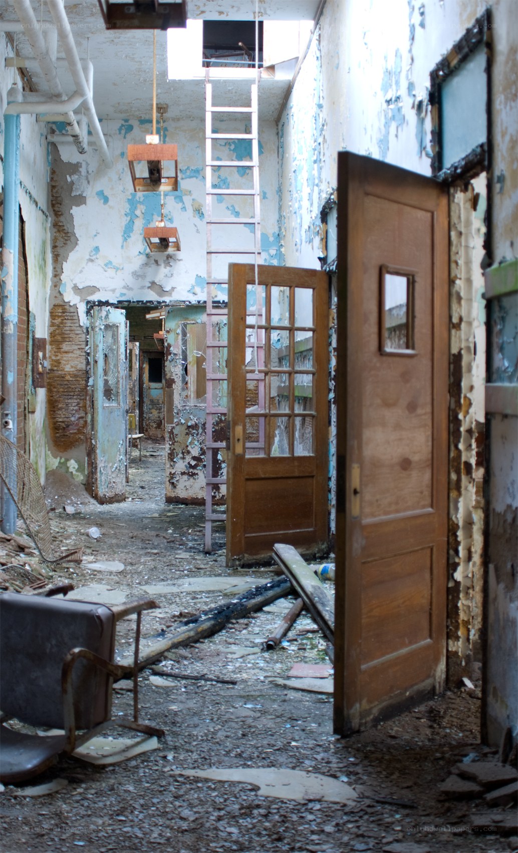 abandoned hallway with peeling paint