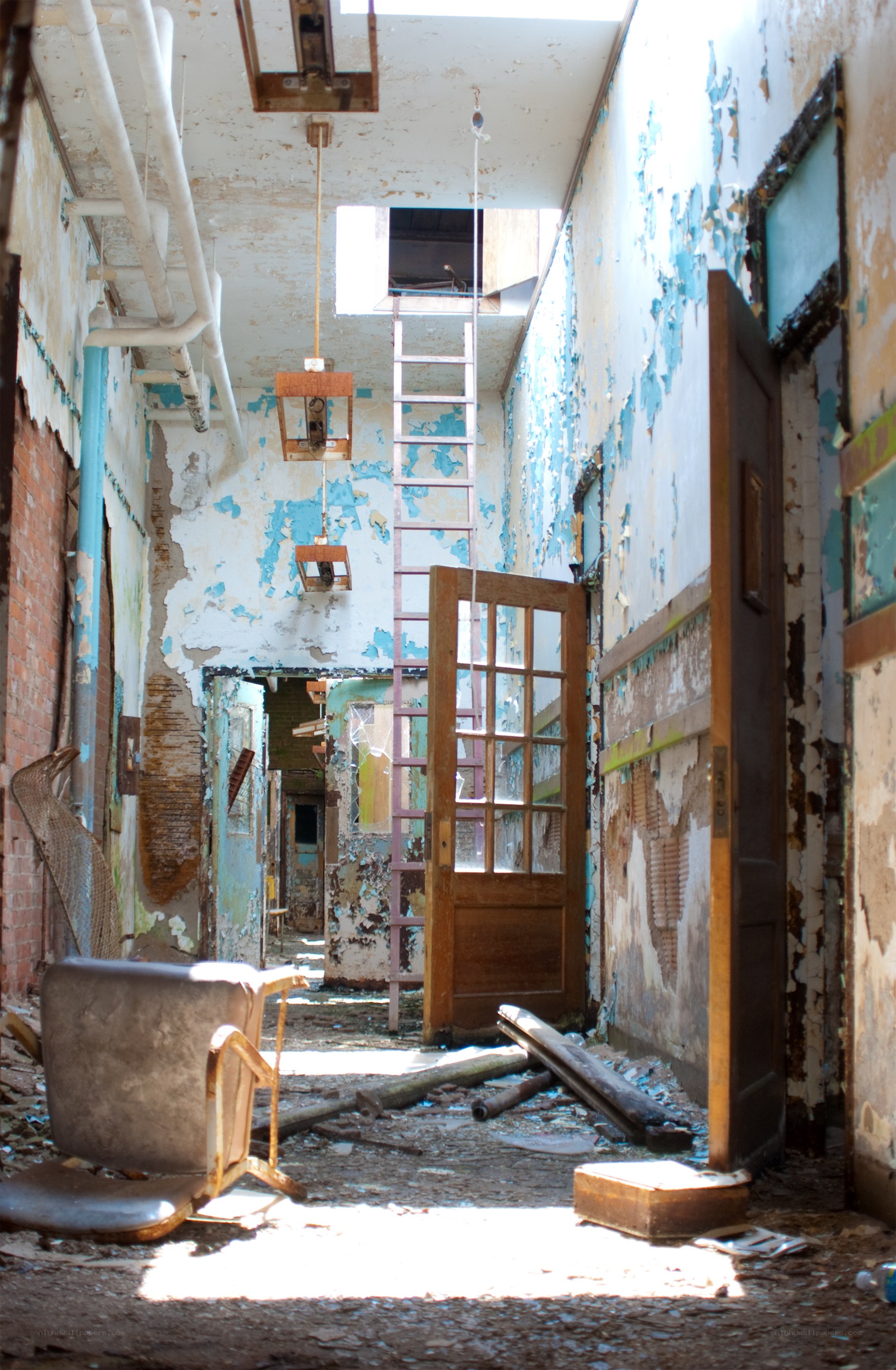 abandoned hallway with peeling paint