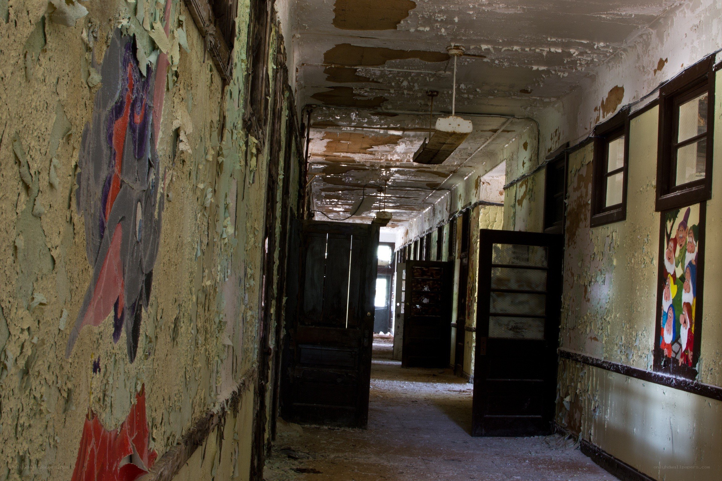 abandoned hallway with peeling paint