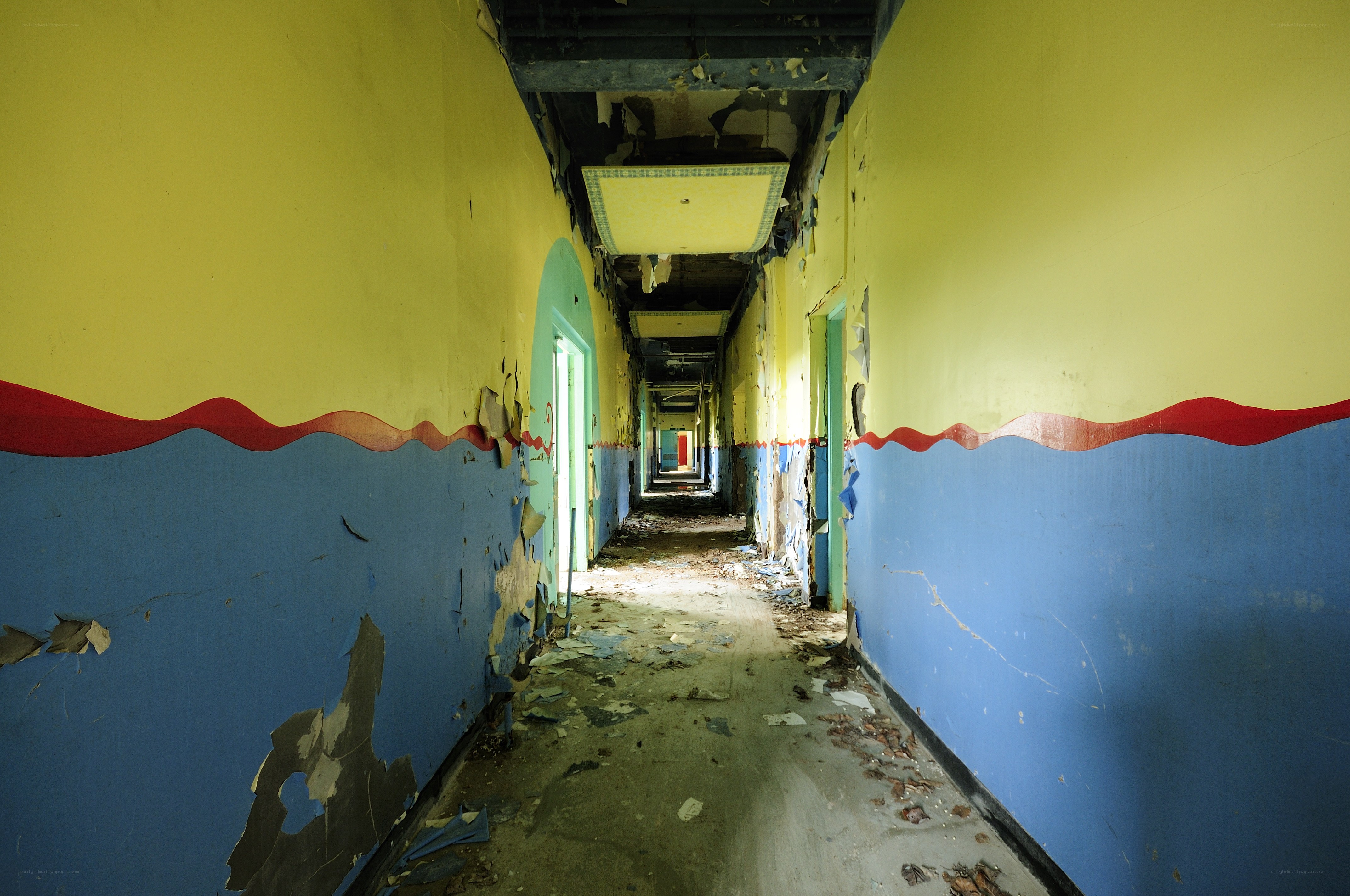abandoned hallway with peeling paint