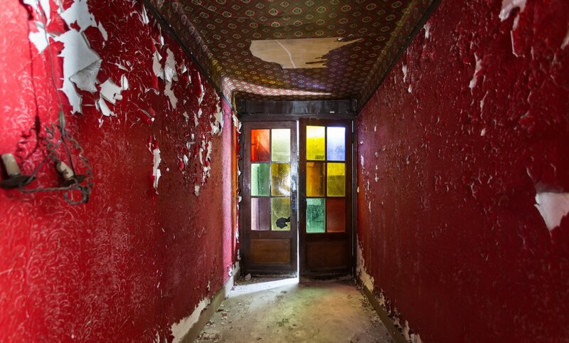 Abandoned Hallway with Stained Glass