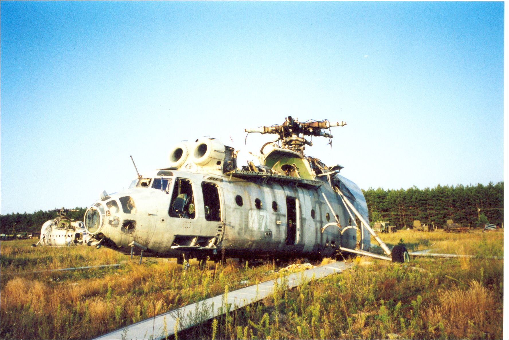 Abandoned helicopter in a field