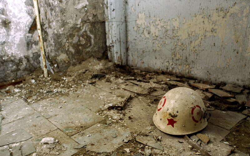 Abandoned helmet in ruined room