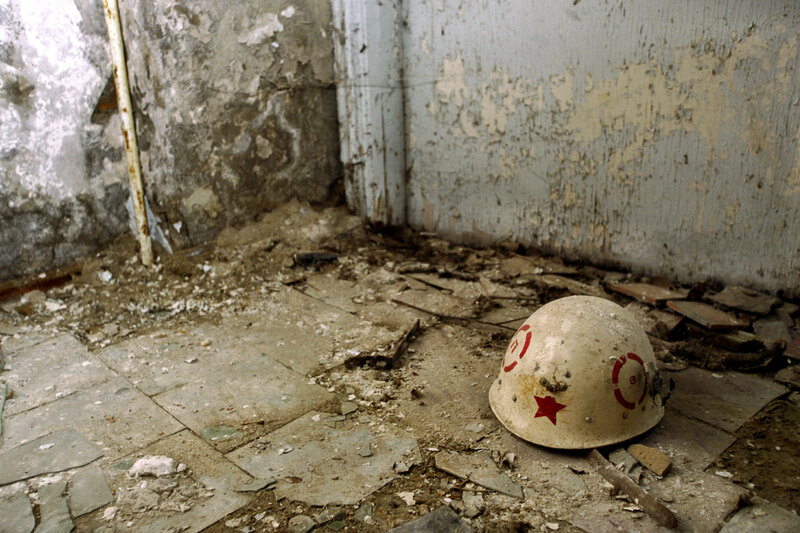 Abandoned helmet in ruined room