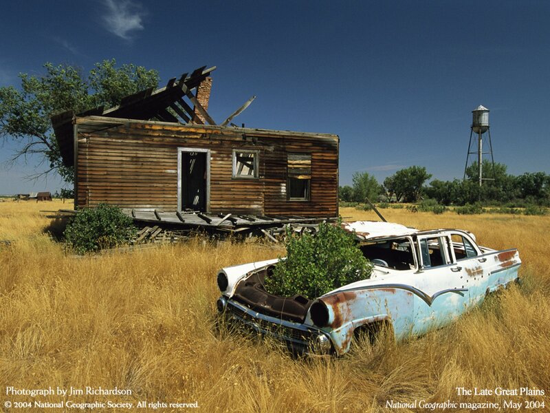 Abandoned house and car in prairie