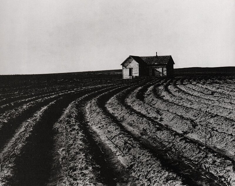 Abandoned house in a plowed field