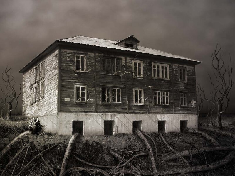 Abandoned house in desolate landscape