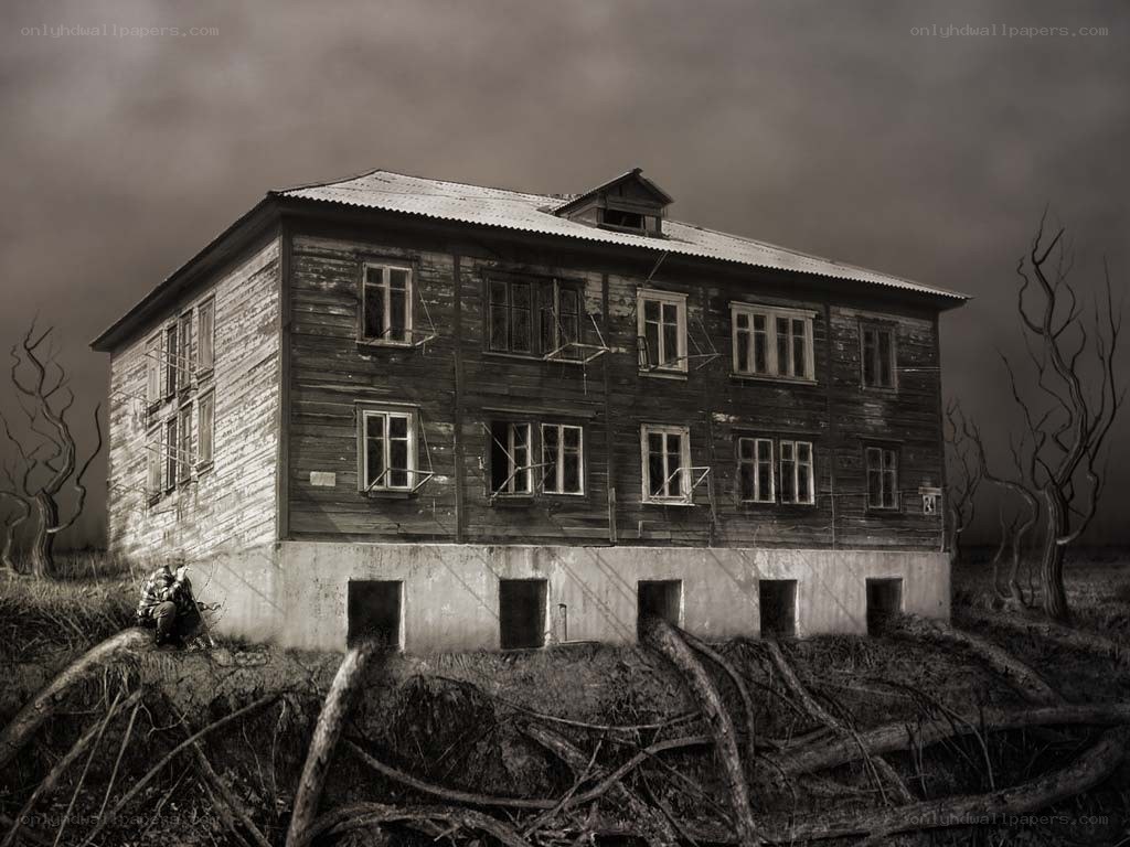Abandoned house in desolate landscape