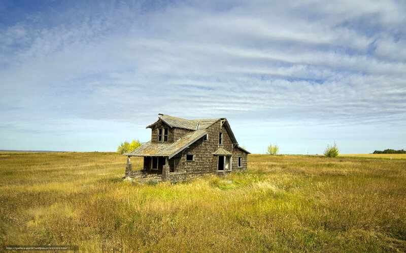 Abandoned house in field