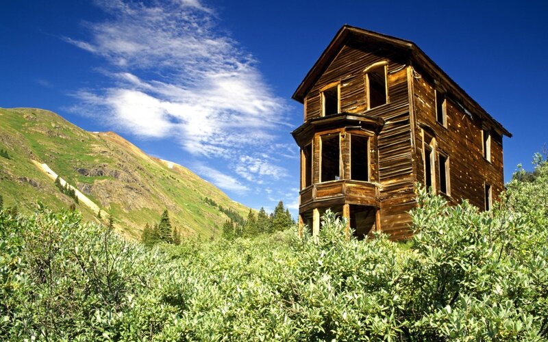 Abandoned house in mountain valley