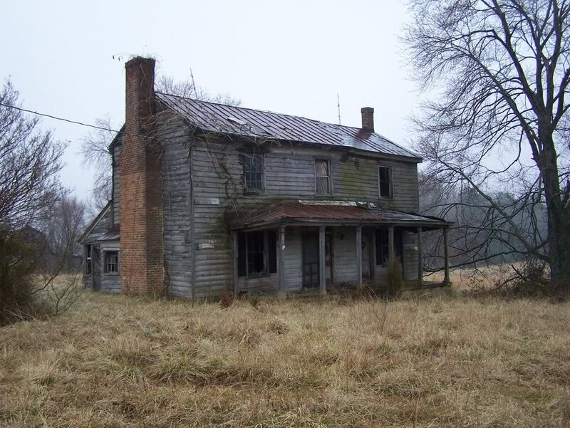 abandoned house in rural field
