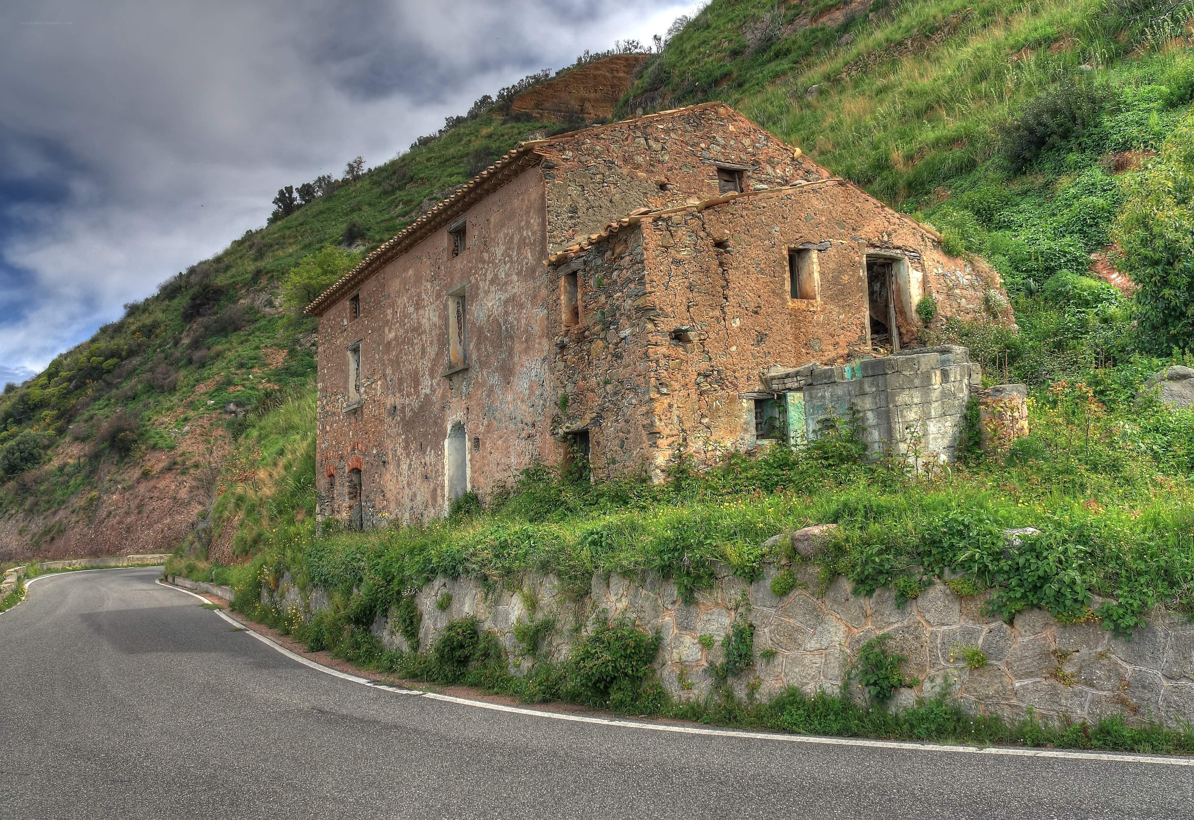 Abandoned house on a hillside