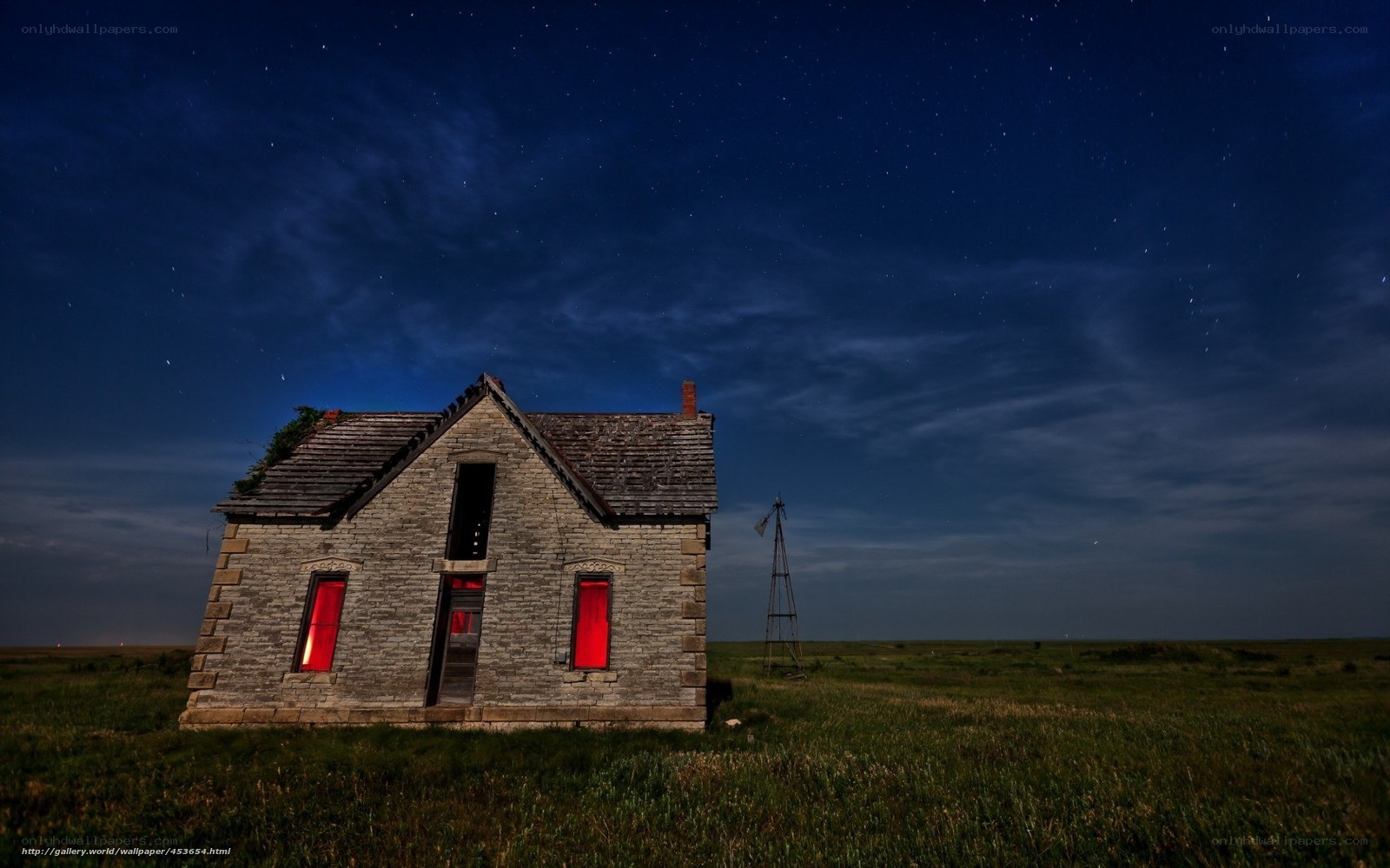 Abandoned house under starry sky