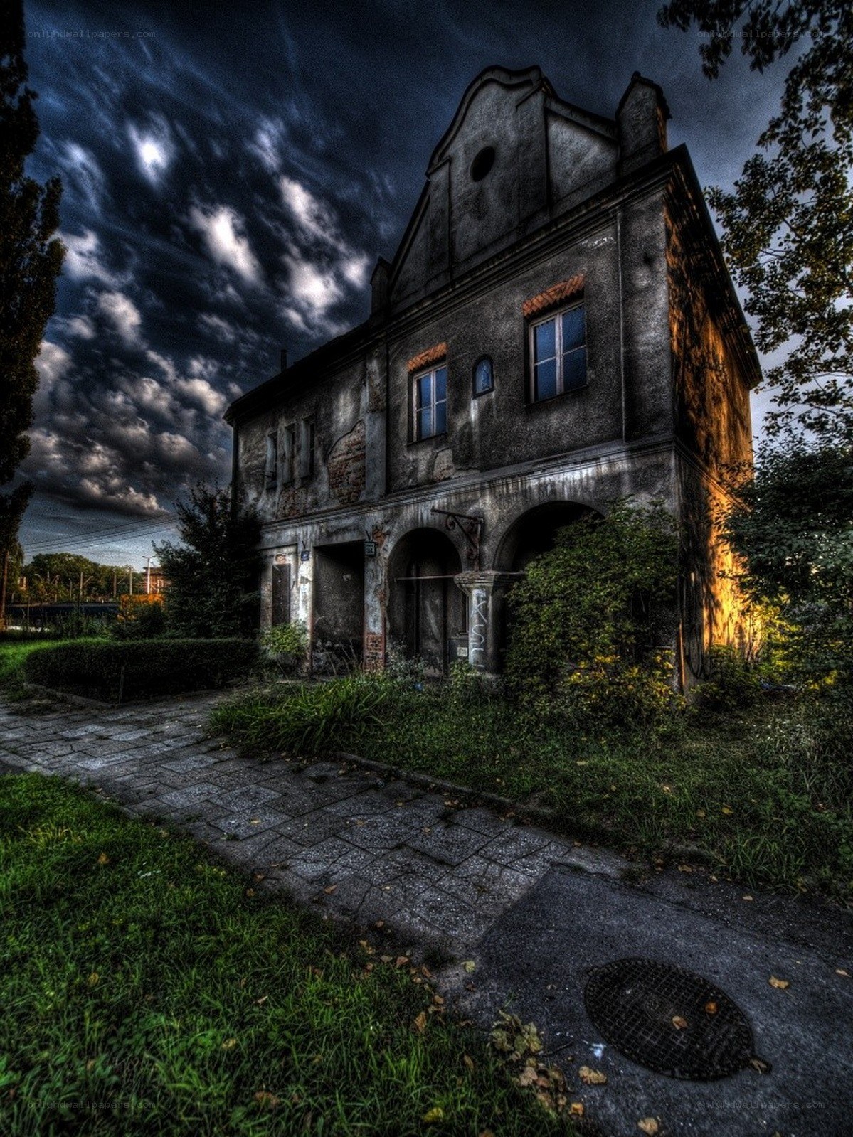 abandoned house under stormy sky