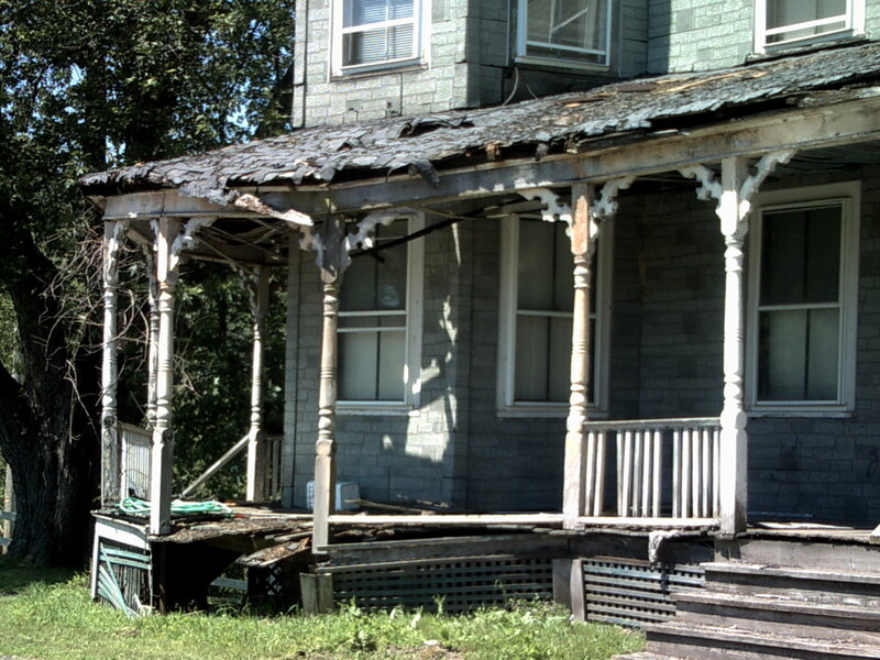 abandoned house with porch