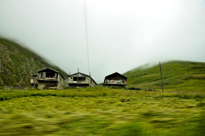 abandoned houses in a misty valley