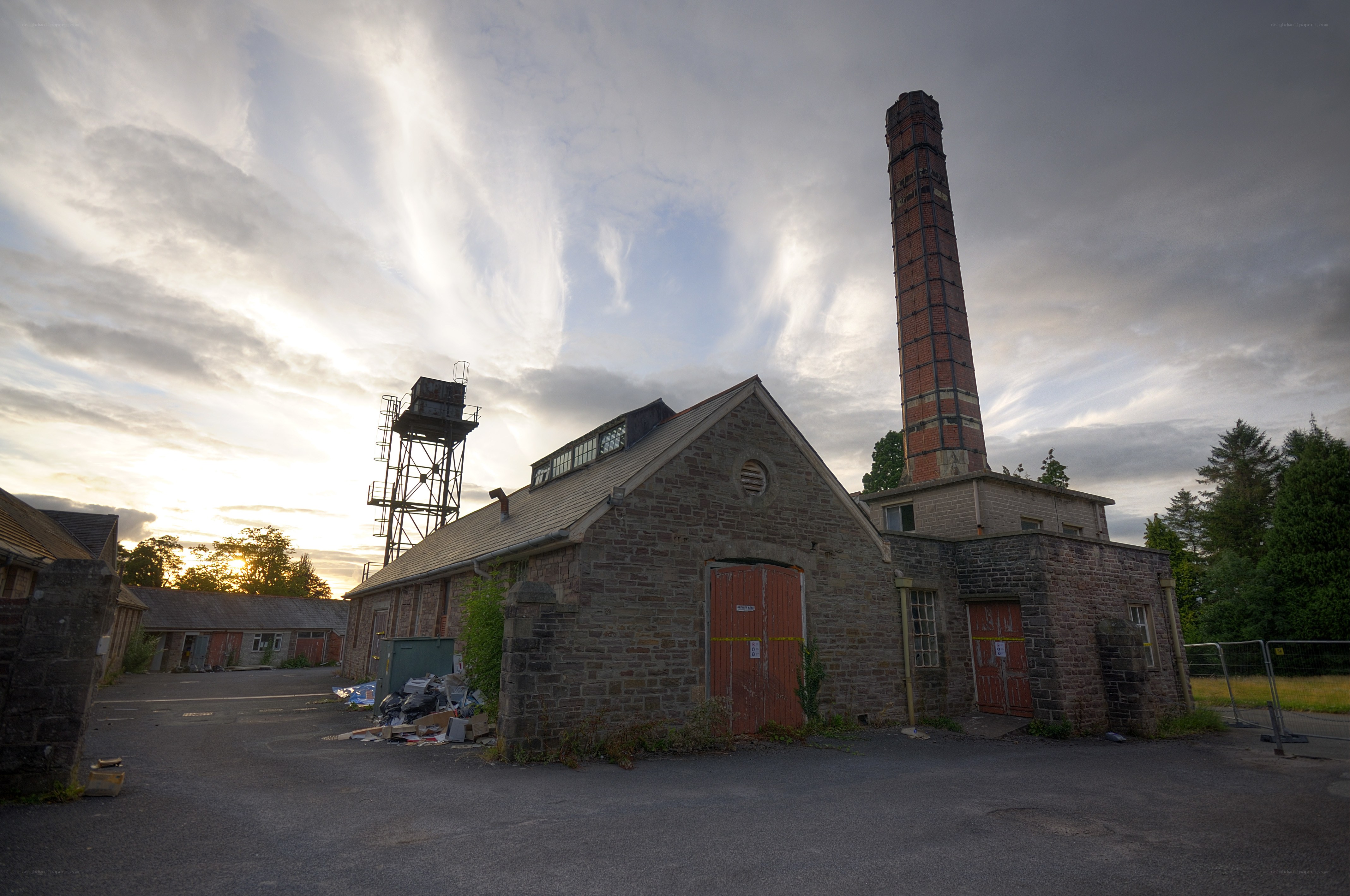 Abandoned industrial building at sunset