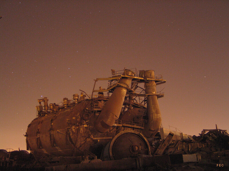 Abandoned industrial machinery at night