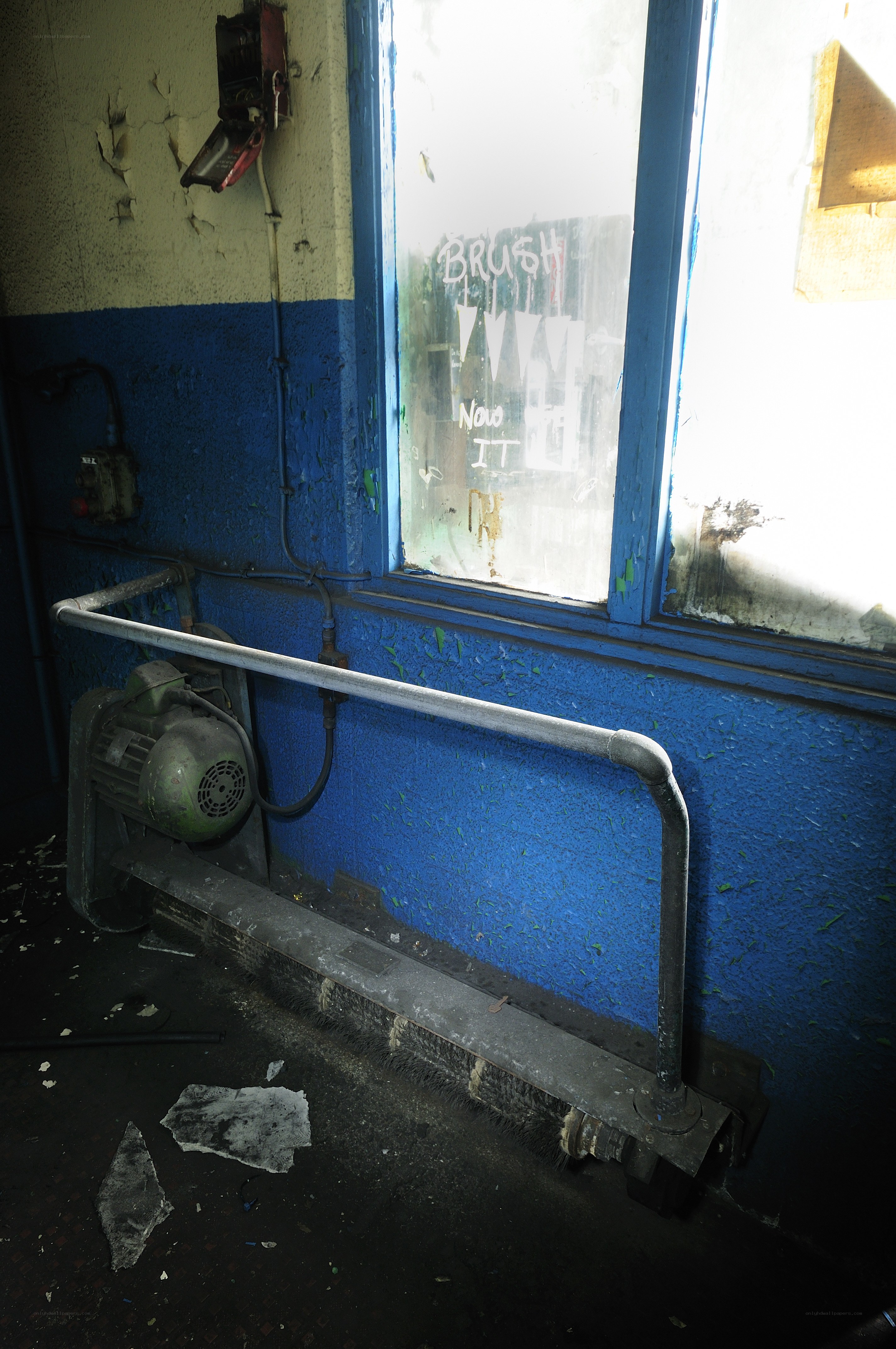 abandoned industrial room with window